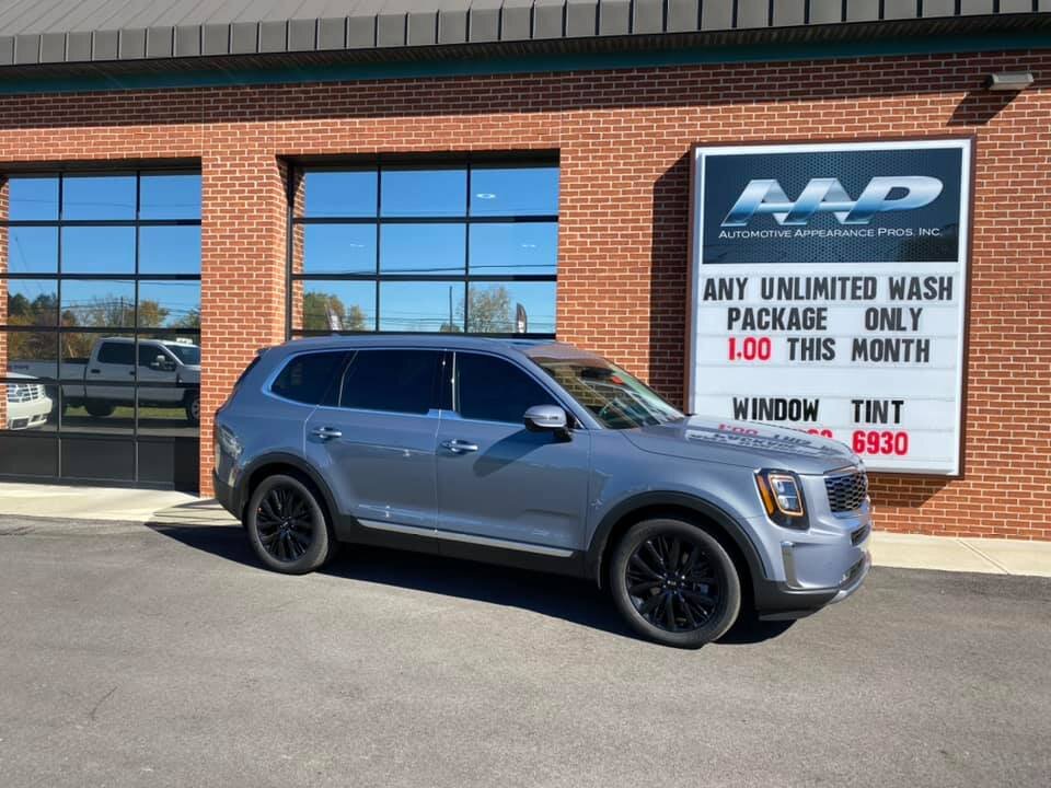 AAPR Vehicle with tint at exterior of building