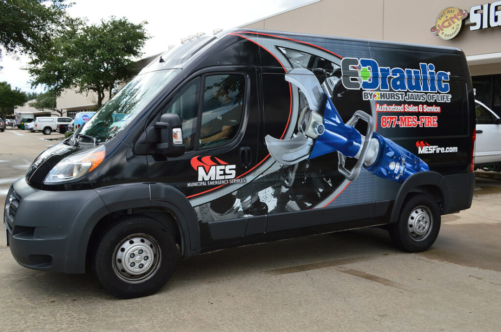 Van displaying vehicle wrap by Auto Additions