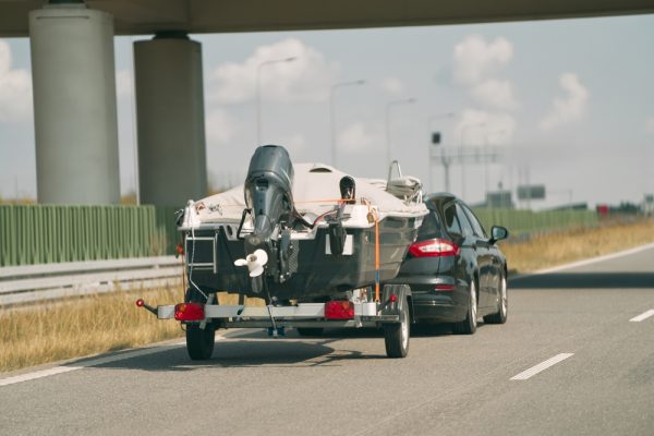 Car Towing Boat Trailer On Open Highway Class I & II Hitches