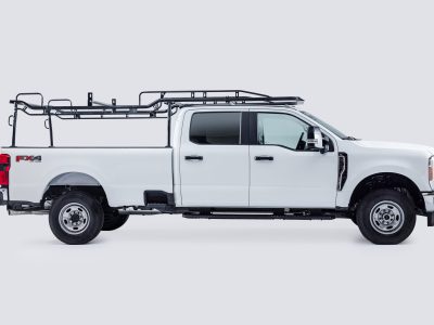 A white truck featuring a rack on its back, ready for hauling. A white truck featuring a rack on its back, ready for hauling.